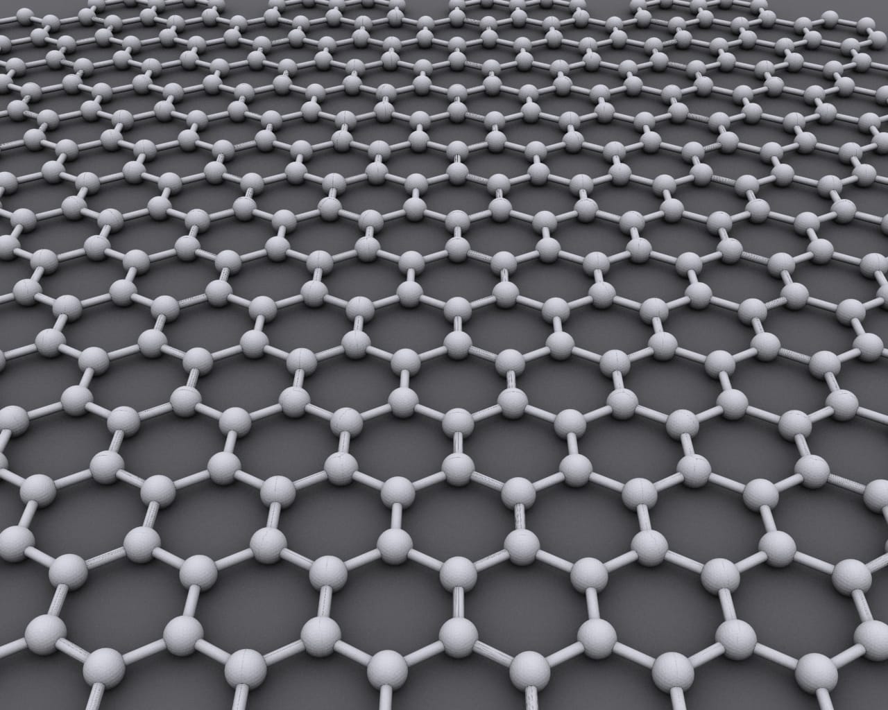 The hexagonal lattice of graphene, a single atomic layer of carbon. The structure gives it the highest measured strength and thermal conductivity of any known material.