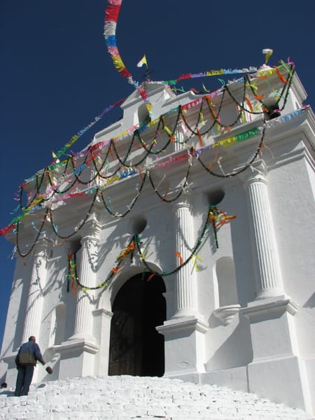 The church of Santo Tomas rising above the famous highland market of Chichicastenango. On its steps Maya ritual blends with Catholic worship, one glimpse of the vivid indigenous culture that pervades Guatemalan life.