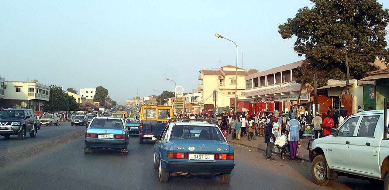 A street scene in Bissau, the capital and largest city of Guinea-Bissau. A faded colonial-era port on the coast, it is the heart of a small, young, and largely rural nation long held back by poverty and political turmoil.