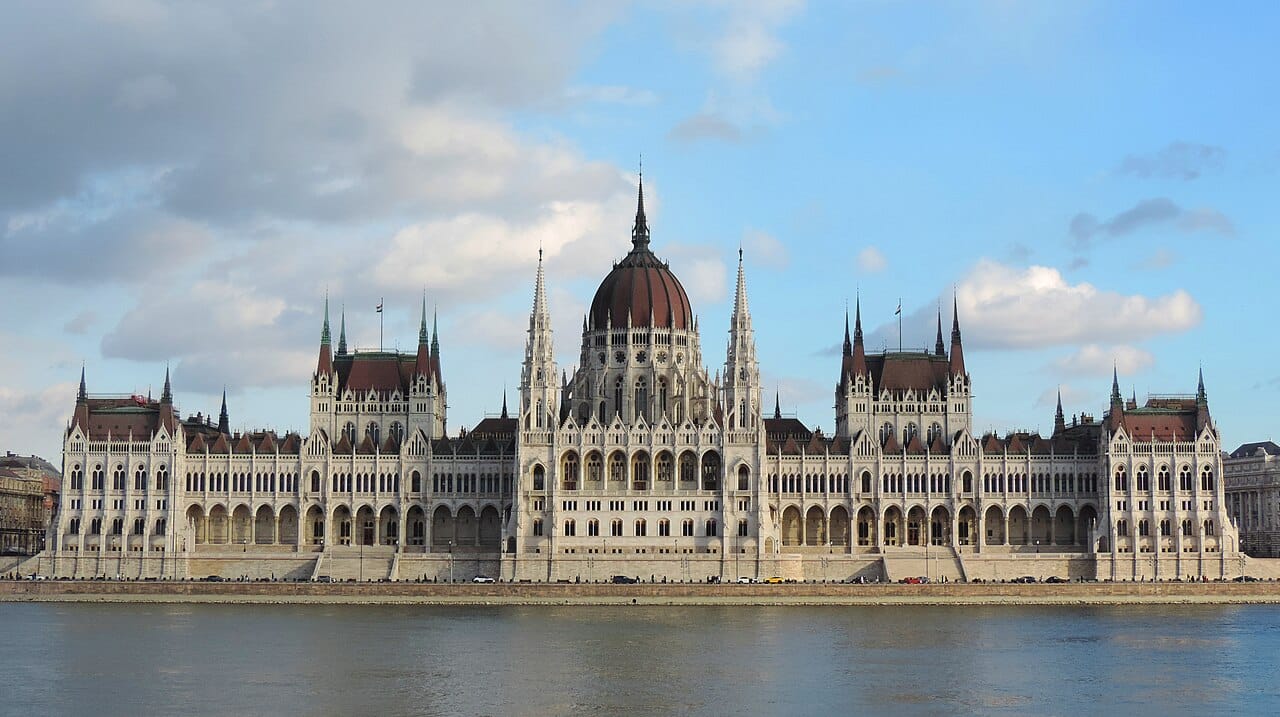 The vast neo-Gothic Hungarian Parliament Building on the bank of the Danube in Budapest, one of the largest and most ornate legislatures in the world. Completed around 1900, it is a monument to the ambitions of Hungary within the Austro-Hungarian Empire.