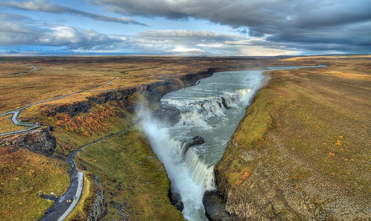 The waterfall of Gullfoss, plunging in tiers into a rugged canyon, one of Iceland's most famous natural wonders. The island's countless waterfalls, fed by glaciers and abundant rain, are among the jewels of its dramatic landscape.