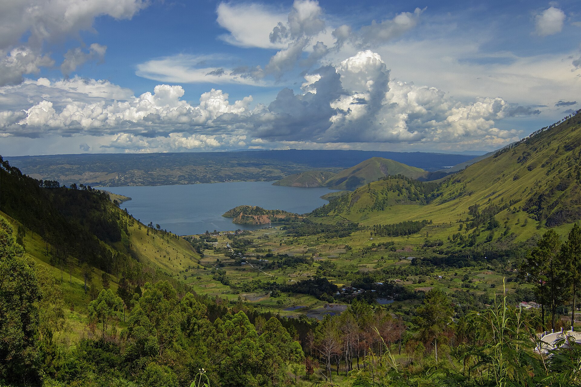 Lake Toba in Sumatra, a vast crater lake. It fills the caldera of a supervolcano whose eruption around 74,000 years ago was one of the largest in the history of the planet.