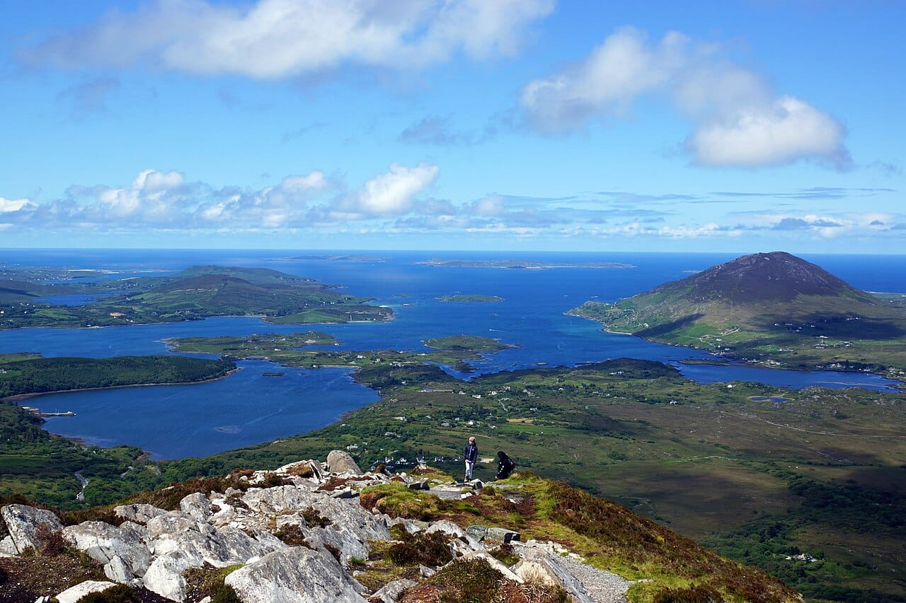 The hills of Connemara in the west of Ireland, a landscape of bog, mountain, and lake where the Irish language still lives. Such wild, beautiful country in the far west is a heartland of traditional Gaelic culture.