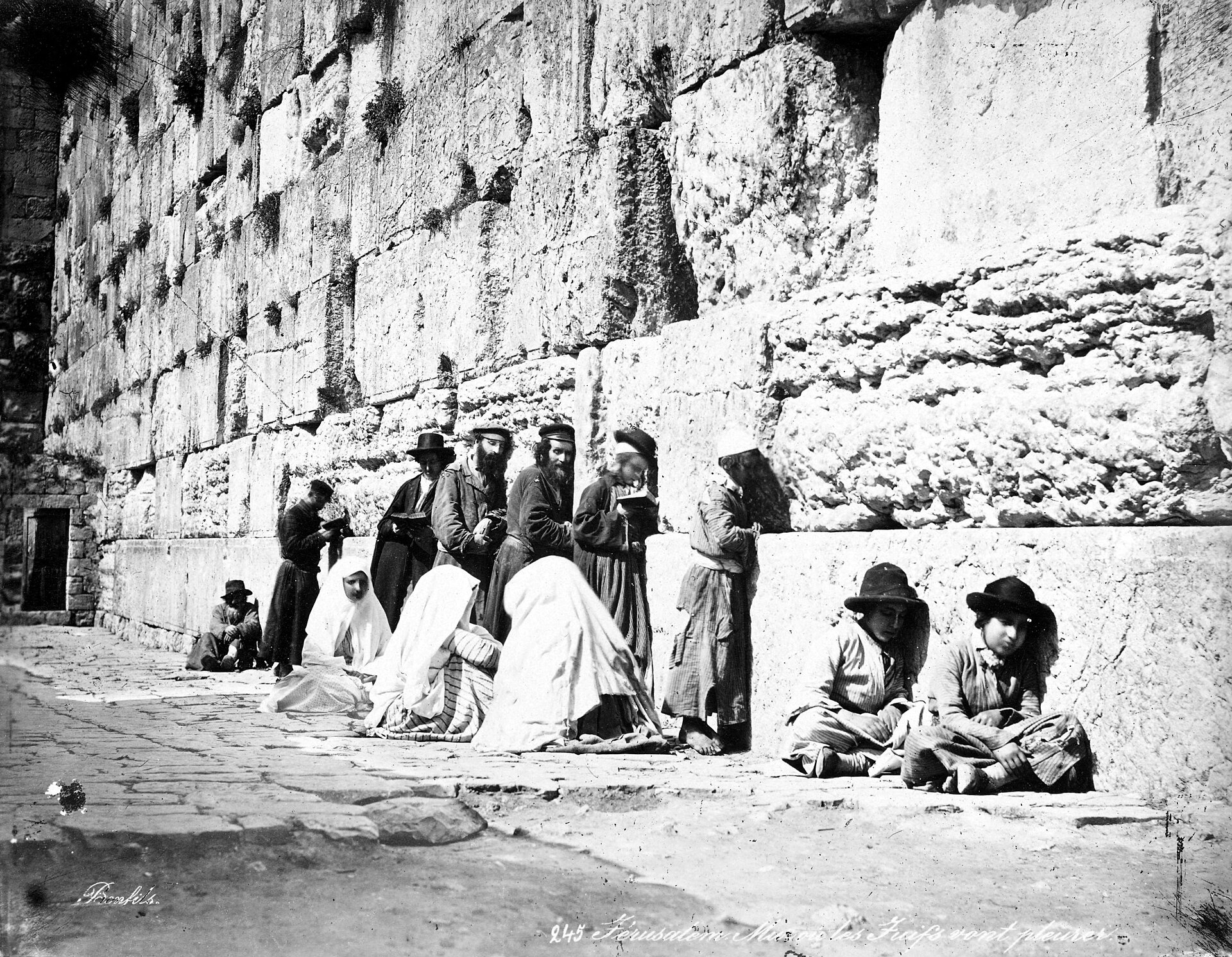 Worshippers at the Western Wall in Jerusalem, one of the holiest sites in Judaism. Credit: Félix Bonfils (Public domain).