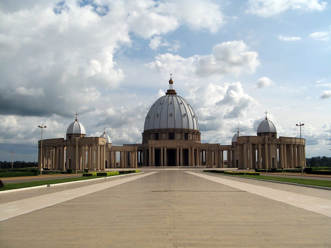 The Basilica of Our Lady of Peace at Yamoussoukro, reputed to be the largest church in the world. Modelled on Saint Peter's in Rome and built under President Houphouet-Boigny, it rises, astonishingly, from a modest town in the heart of West Africa.