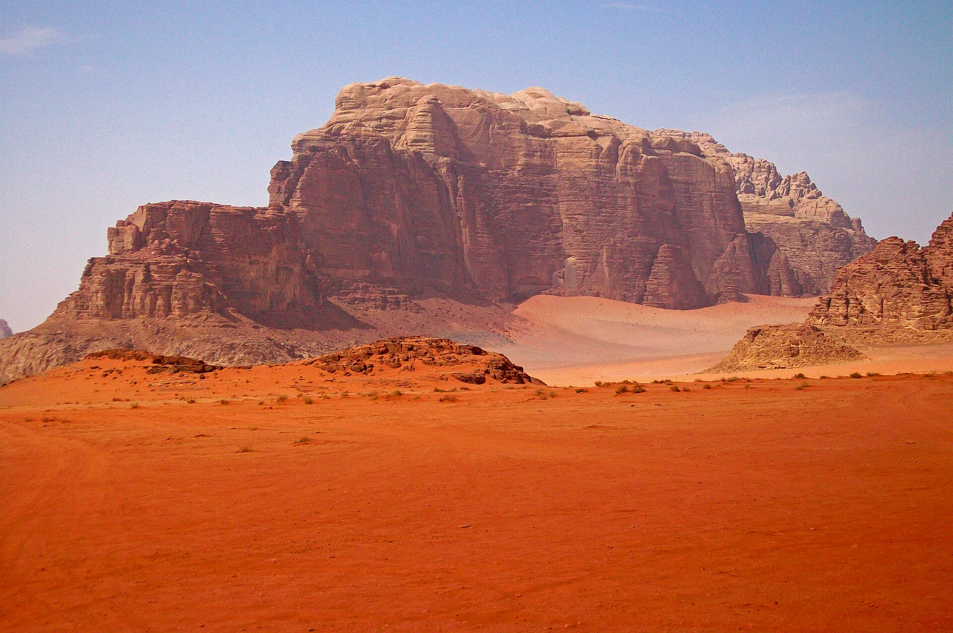 The desert of Wadi Rum in southern Jordan, with its towering sandstone mountains rising from red sand. Long inhabited by Bedouin, this dramatic landscape has stood in for other worlds in many films.