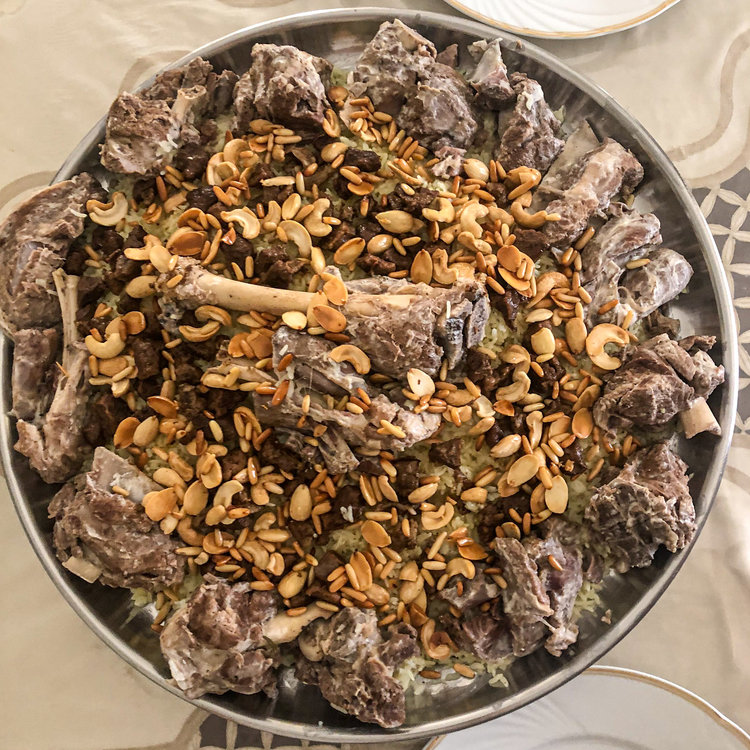 Mansaf, the national dish of Jordan, lamb cooked in a sauce of fermented dried yogurt and served over rice and flatbread. Traditionally eaten from a shared platter, it is the centrepiece of celebrations and of Jordanian hospitality.