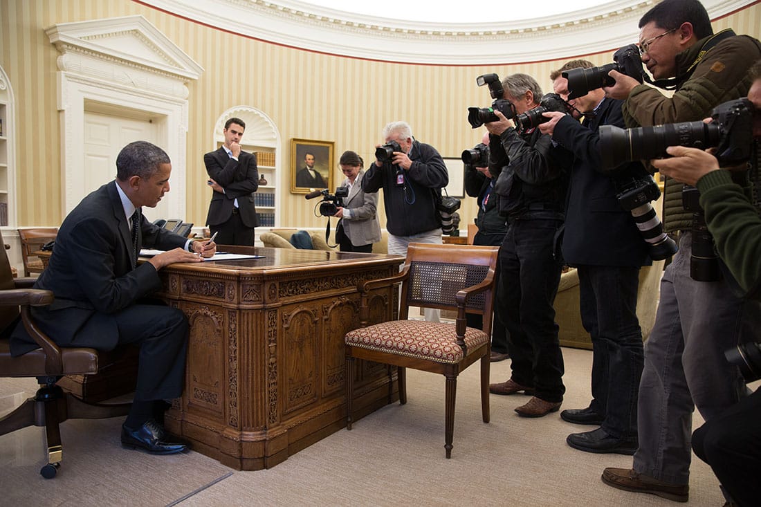 Photojournalists at work. Journalism is defined by the practices applied to information before publication rather than by the medium carrying it.