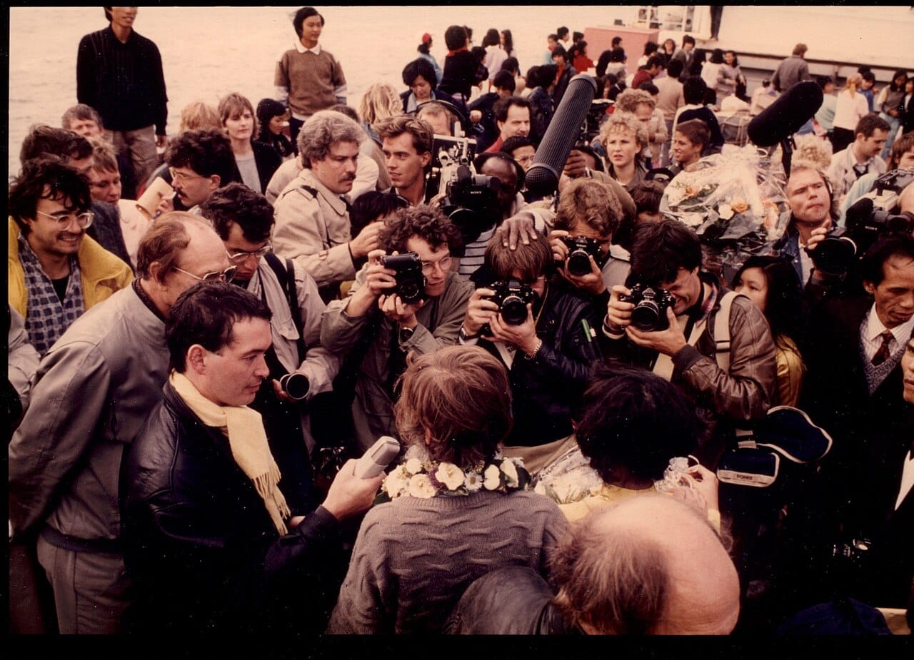 A press scrum. Competition for immediacy has intensified as publication became continuous rather than tied to an edition or a bulletin.
