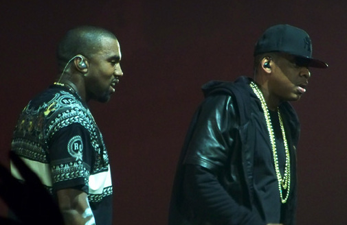 West, right, with Jay-Z in 2011; West gained early acclaim producing Jay-Z's *The Blueprint*.