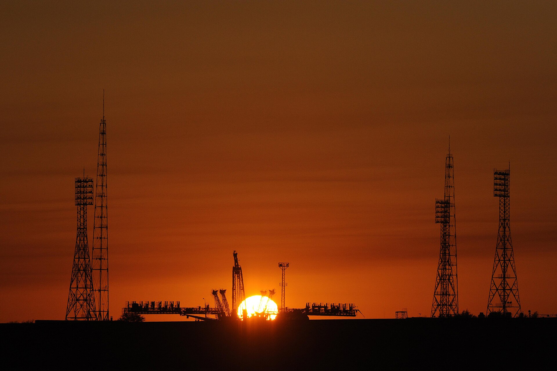 A Soyuz rocket on the launch pad at the Baikonur Cosmodrome, leased to Russia on the Kazakh steppe. From here the first satellite and the first human were launched into space, and crews still fly to orbit today.