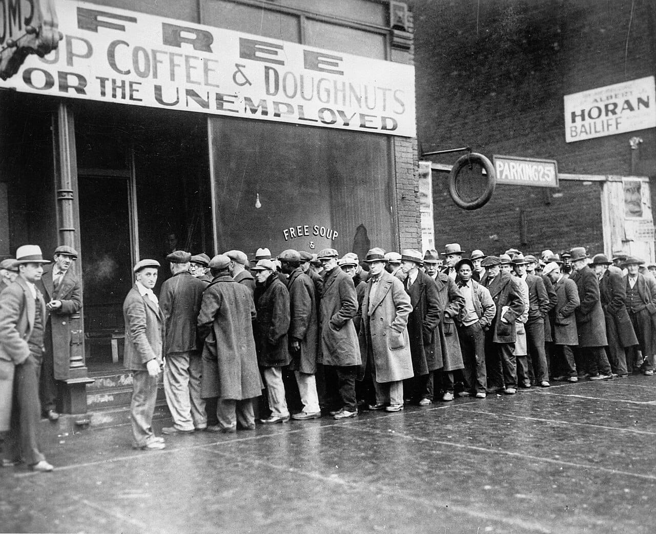 Unemployed men queuing at a soup kitchen during the Great Depression. Mass unemployment persisting for years was the phenomenon existing theory could not adequately explain.