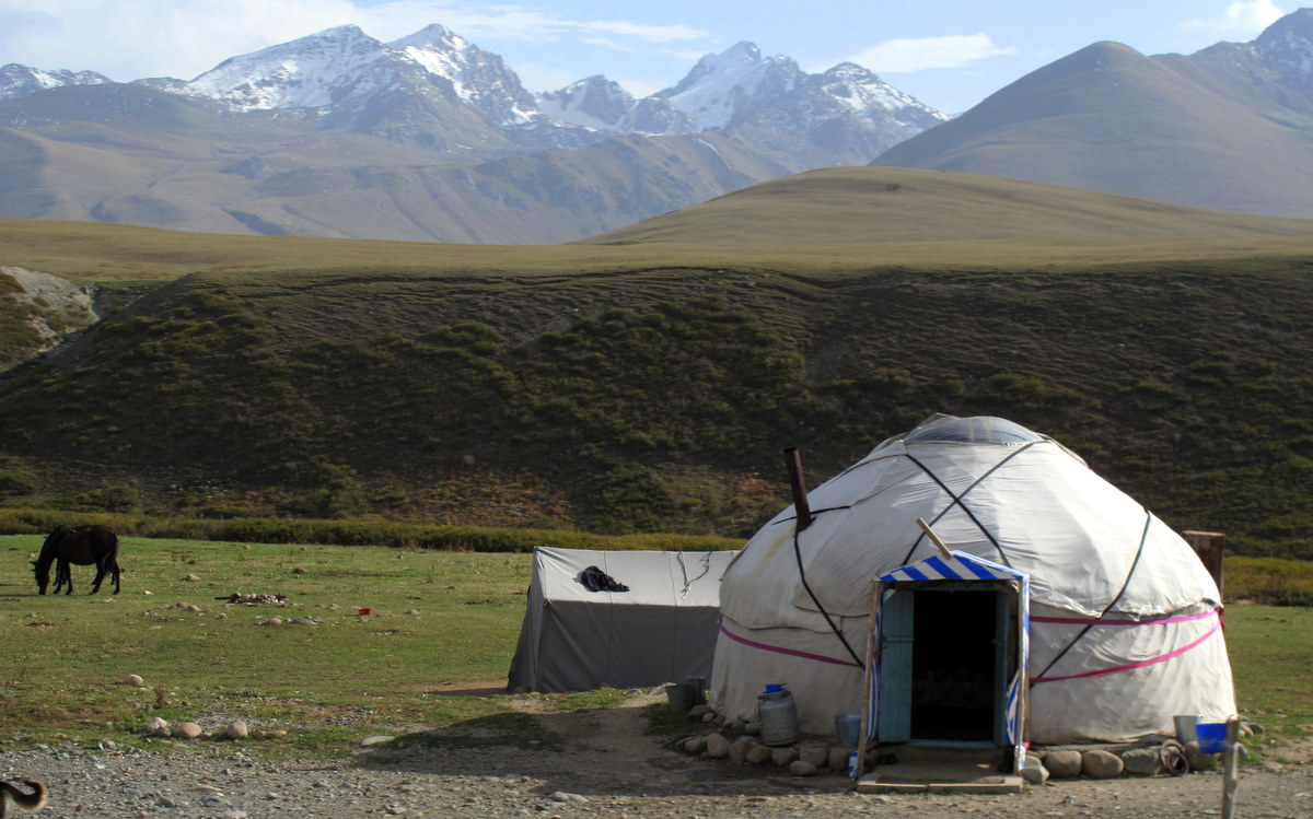 Herders in a high valley of Kyrgyzstan, where nomadic traditions of pasturing livestock endure. Credit: Peretz Partensky from San Francisco, USA (CC BY-SA 2.0).