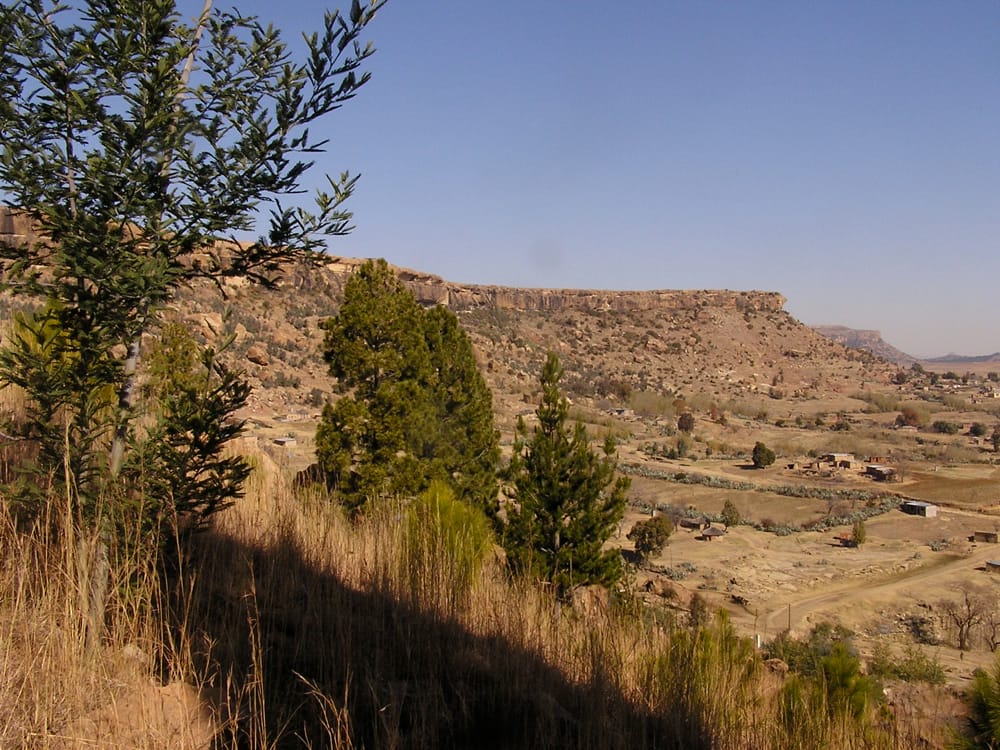 Thaba Bosiu, the flat-topped mountain that Moshoeshoe made his capital and fortress. Its natural defences, never breached by an enemy, were the anchor of the Basotho nation through the turbulent nineteenth century.