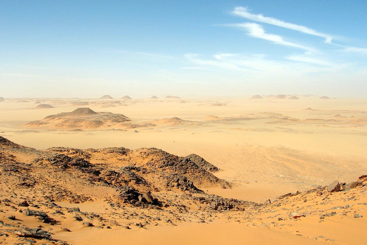 The Libyan Desert. About ninety per cent of the country is Sahara, with no permanent river anywhere in it, and the population is confined to two coastal strips and a scattering of oases.