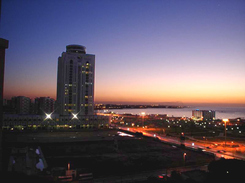 Tripoli at night. The capital holds a large share of Libya's seven million people, who live almost entirely in two coastal clusters, around Tripoli in the west and Benghazi in the east, with the desert interior all but empty.