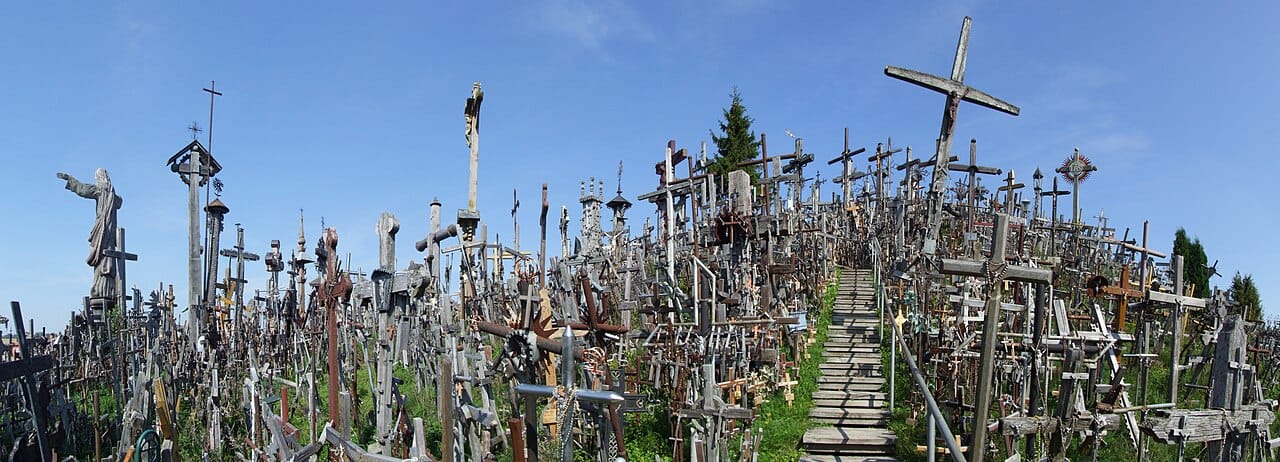 The Hill of Crosses near Siauliai, where generations of Lithuanians have planted a vast, ever-growing forest of crosses. Repeatedly bulldozed under Soviet rule and always rebuilt, it stands as a monument to Catholic faith and national defiance.