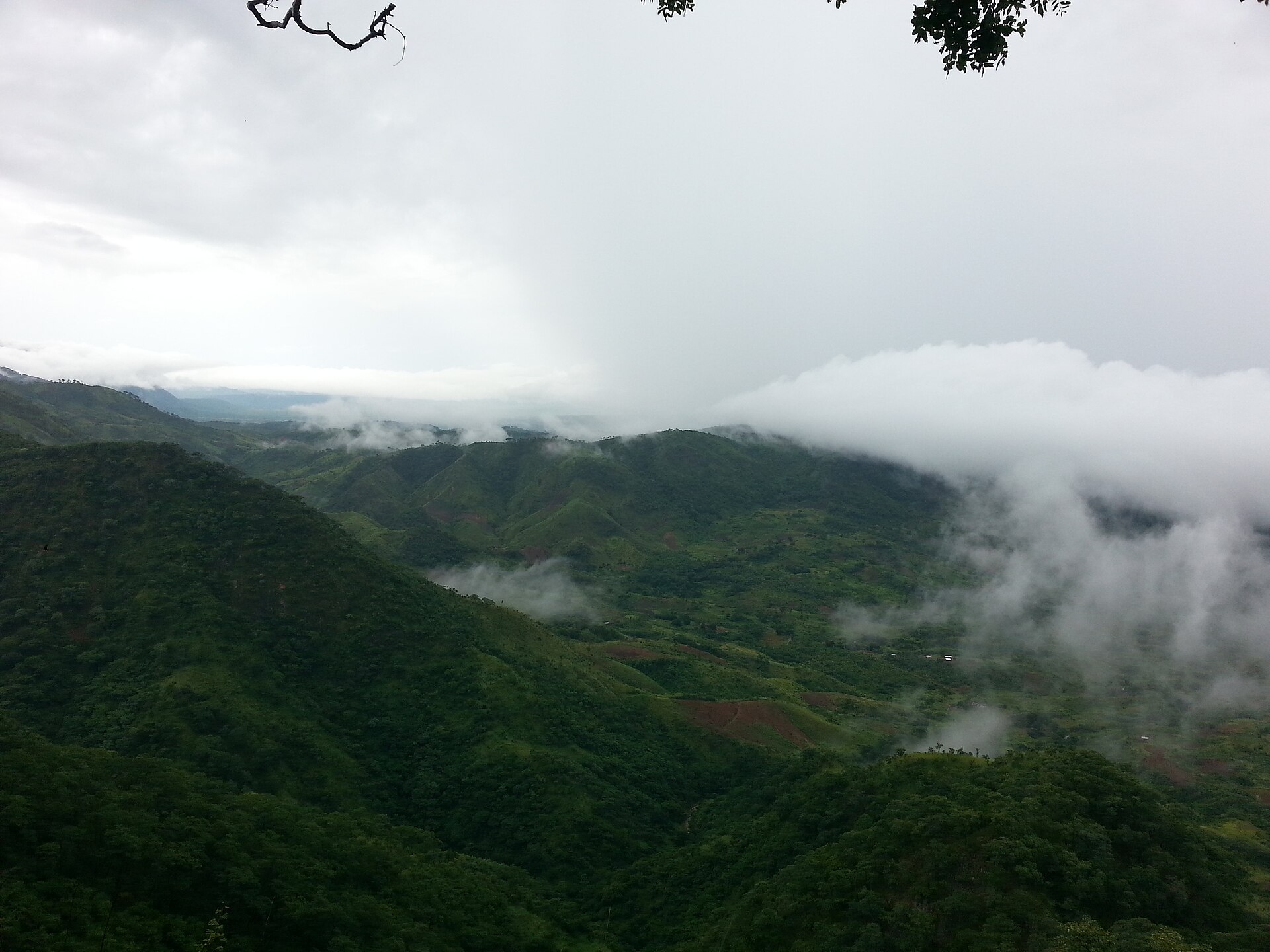 Mountains in northern Malawi in the rainy season. Beyond the great lake, the land rises to green plateaus and dramatic highlands, an intensively farmed and densely peopled country in the Great Rift Valley.