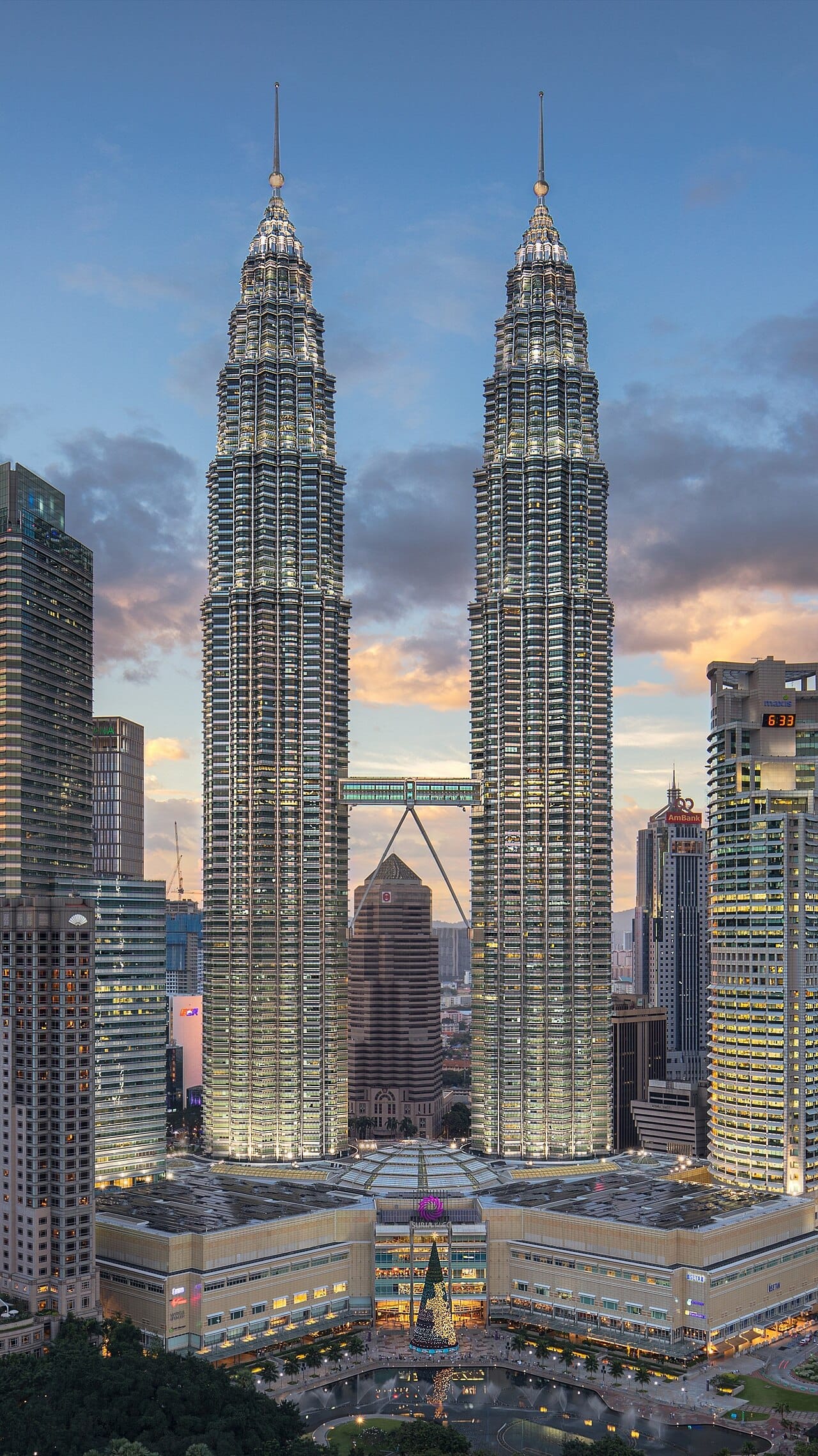 The Petronas Twin Towers rising over Kuala Lumpur, for a time the tallest buildings in the world and the enduring symbol of modern Malaysia. The capital region is the heart of the nation's population, wealth, and ambition.
