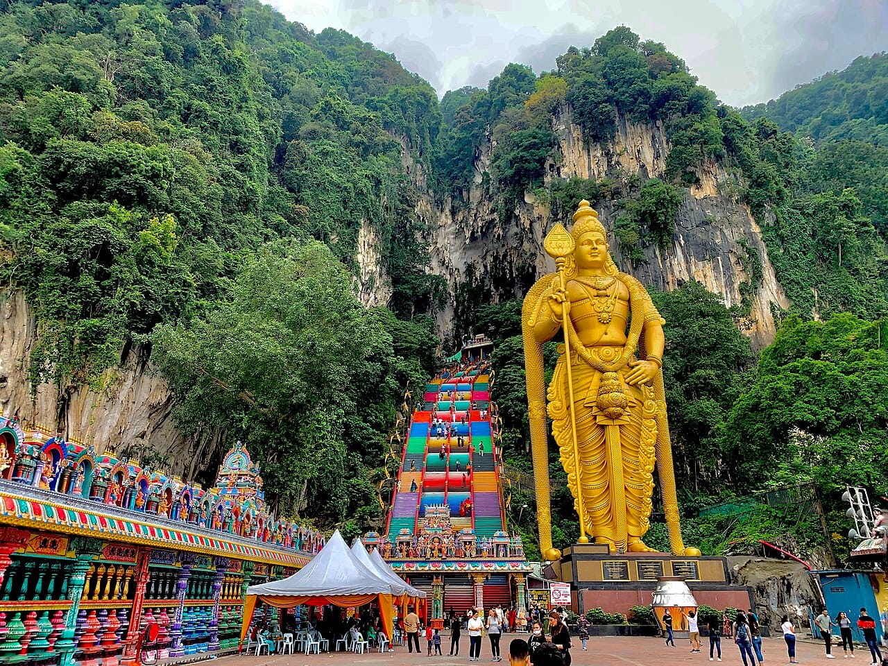 The towering statue and steep steps of the Batu Caves, a Hindu temple in a limestone hill near Kuala Lumpur and a focus of the Thaipusam festival. It reflects the large Malaysian Indian community, one of the many strands of the country's diverse society.