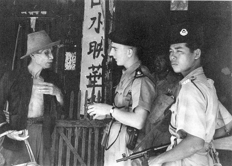 A scene from the Malayan Emergency, part of the turbulent path from colonial rule to independence. Credit: Photo by Bert Hardy, uploaded to wikipedia by Pengguna:Rizuan at ms:wikipedia (Public domain).
