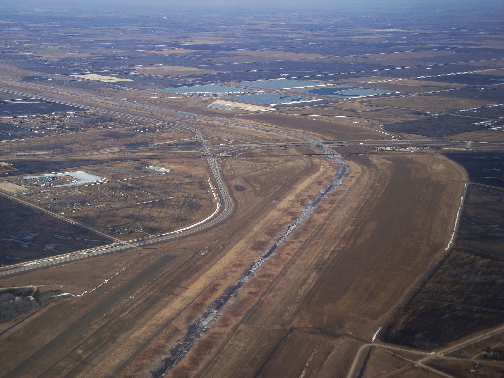 The Red River Floodway, a vast channel dug around Winnipeg in the 1960s to divert flood waters away from the city. Nicknamed Duff's Ditch, it has spared the capital from disaster many times on a river prone to severe spring flooding.
