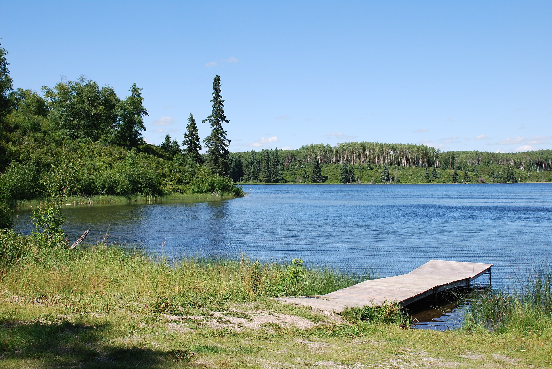 Deep Lake in Riding Mountain National Park, an island of forested highland rising above the surrounding farmland in western Manitoba. The park is one of the province's best-loved wild places.