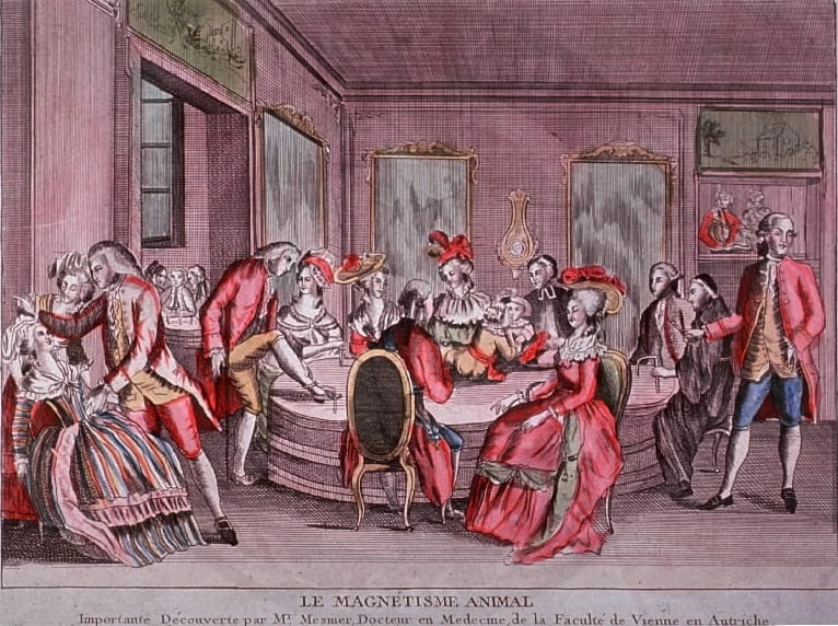A group treatment around the baquet. Patients were connected by cords, held rods to the affected part, and frequently underwent convulsive crises, which spread readily through the assembled group.