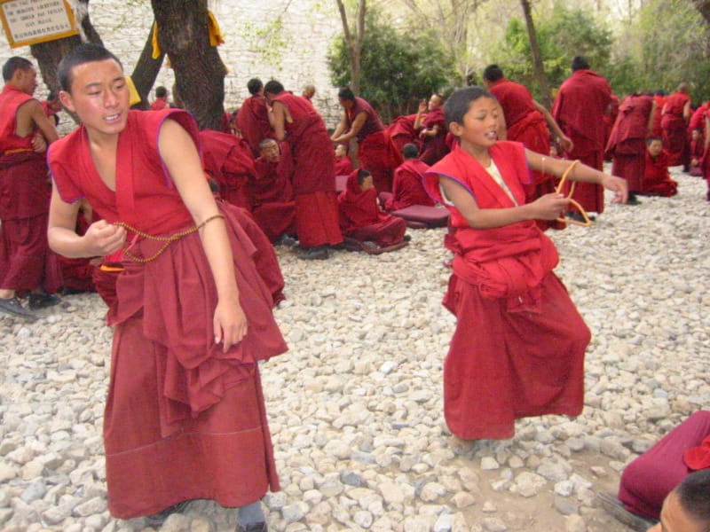 Young monks at a Tibetan monastery. Large monastic institutions have functioned as centres of education and scholarship as well as of religious practice.