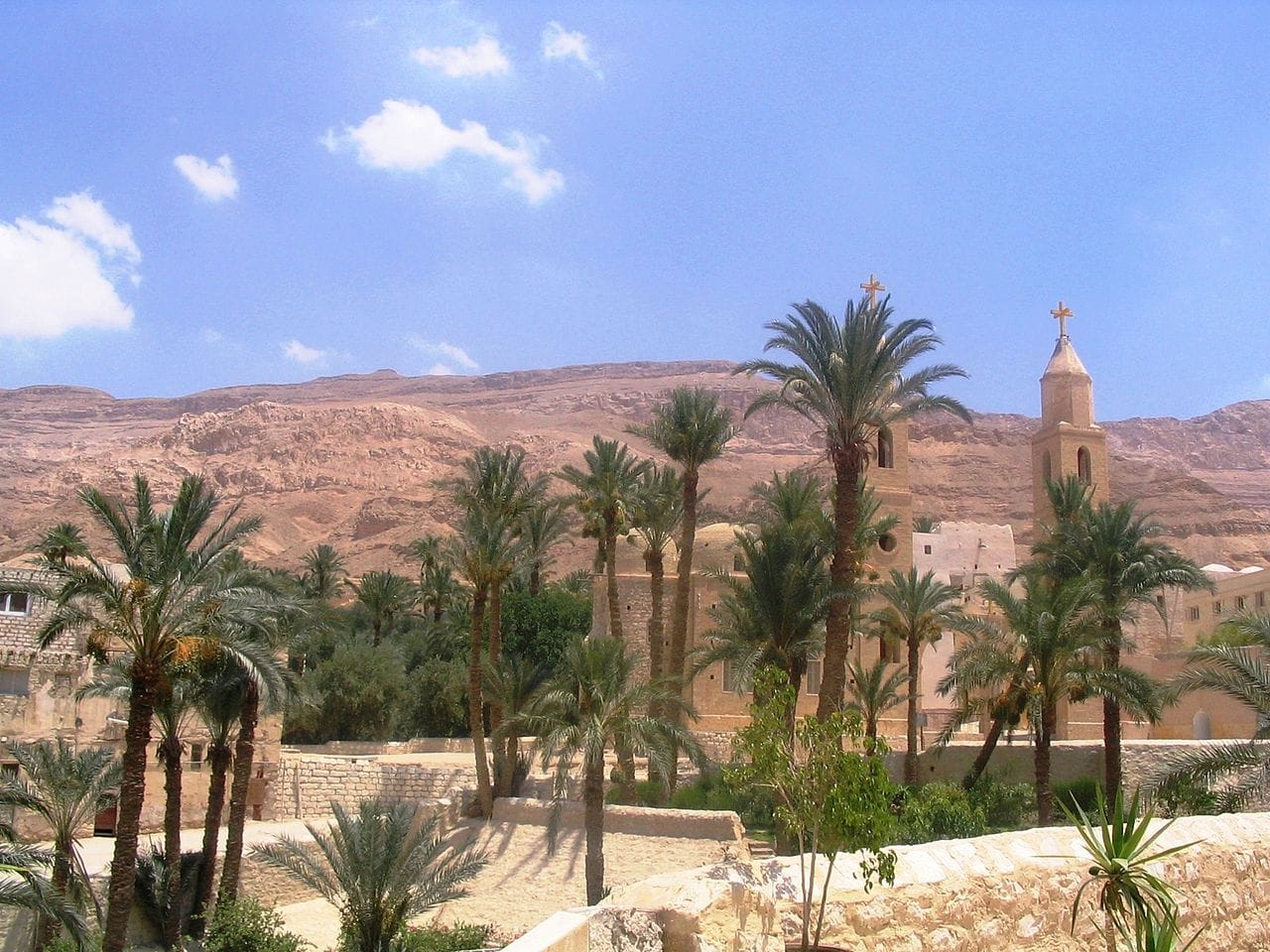 A desert monastery. The tension between withdrawal and accumulated institutional wealth recurs throughout monastic history and is the usual trigger for reform.
