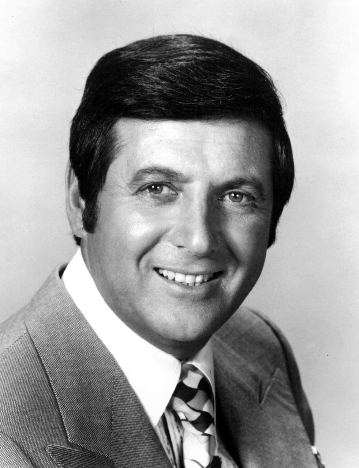 Monty Hall, whose game show gave the problem its name. The show's actual rules differed from the puzzle in ways that matter.