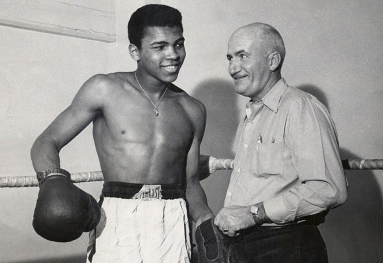 A young Cassius Clay with his first boxing trainer.