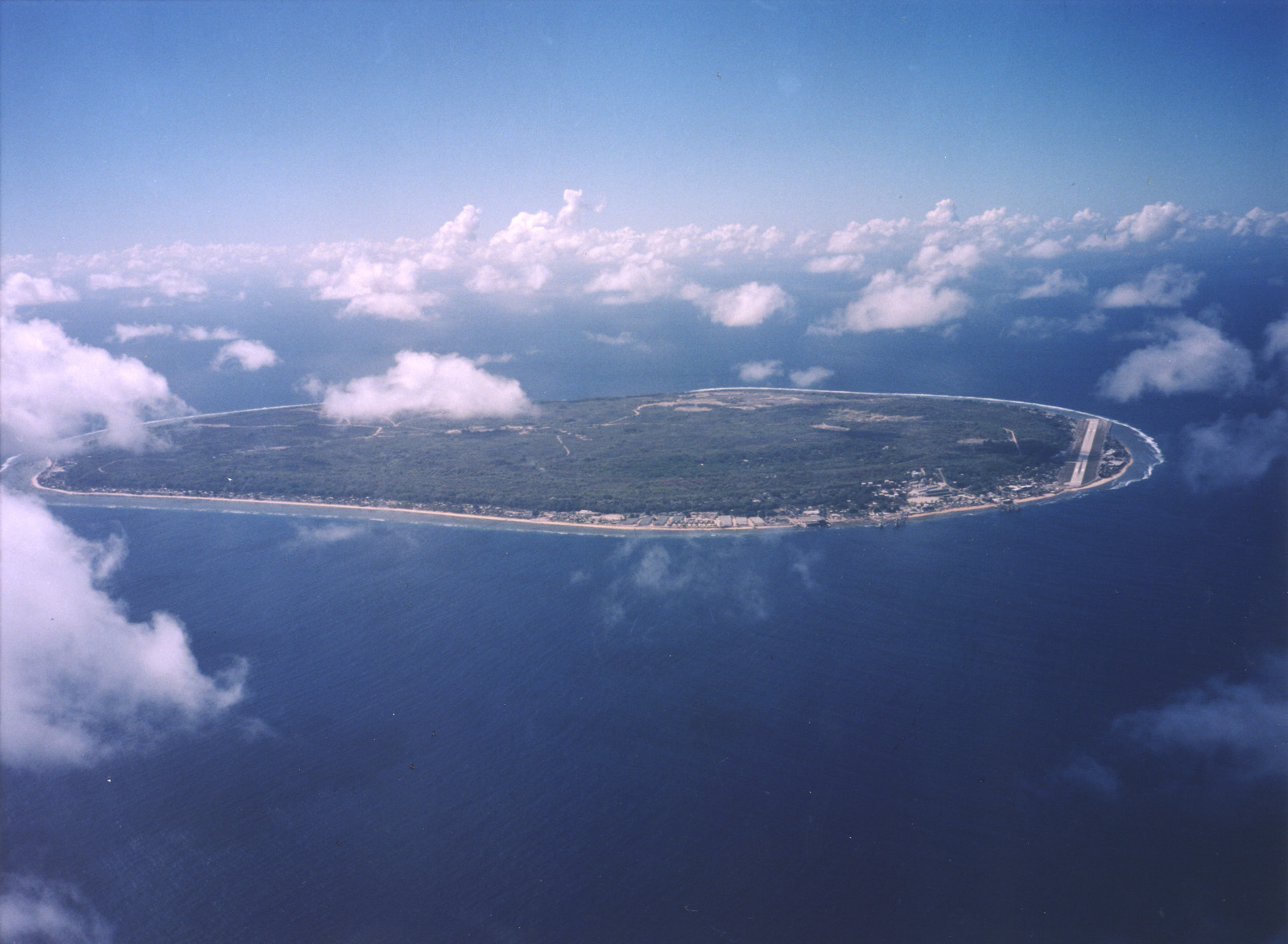 An aerial view of Nauru, a single raised-coral island whose interior was stripped bare by a century of phosphate mining. Credit: U.S. Department of Energy's Atmospheric Radiation Measurement Program (Public domain).