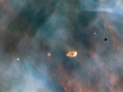 A protoplanetary disk of gas and dust around a young star, the birthplace of planets.