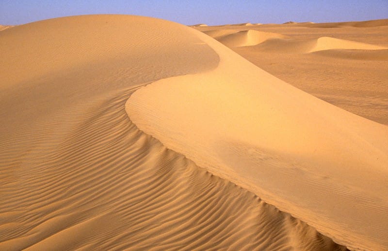 The dunes of the Tenere, a vast desert region of the Sahara in northern Niger. Most of the country is arid and thinly peopled, and the encroachment of the desert and recurring drought are among its greatest challenges.