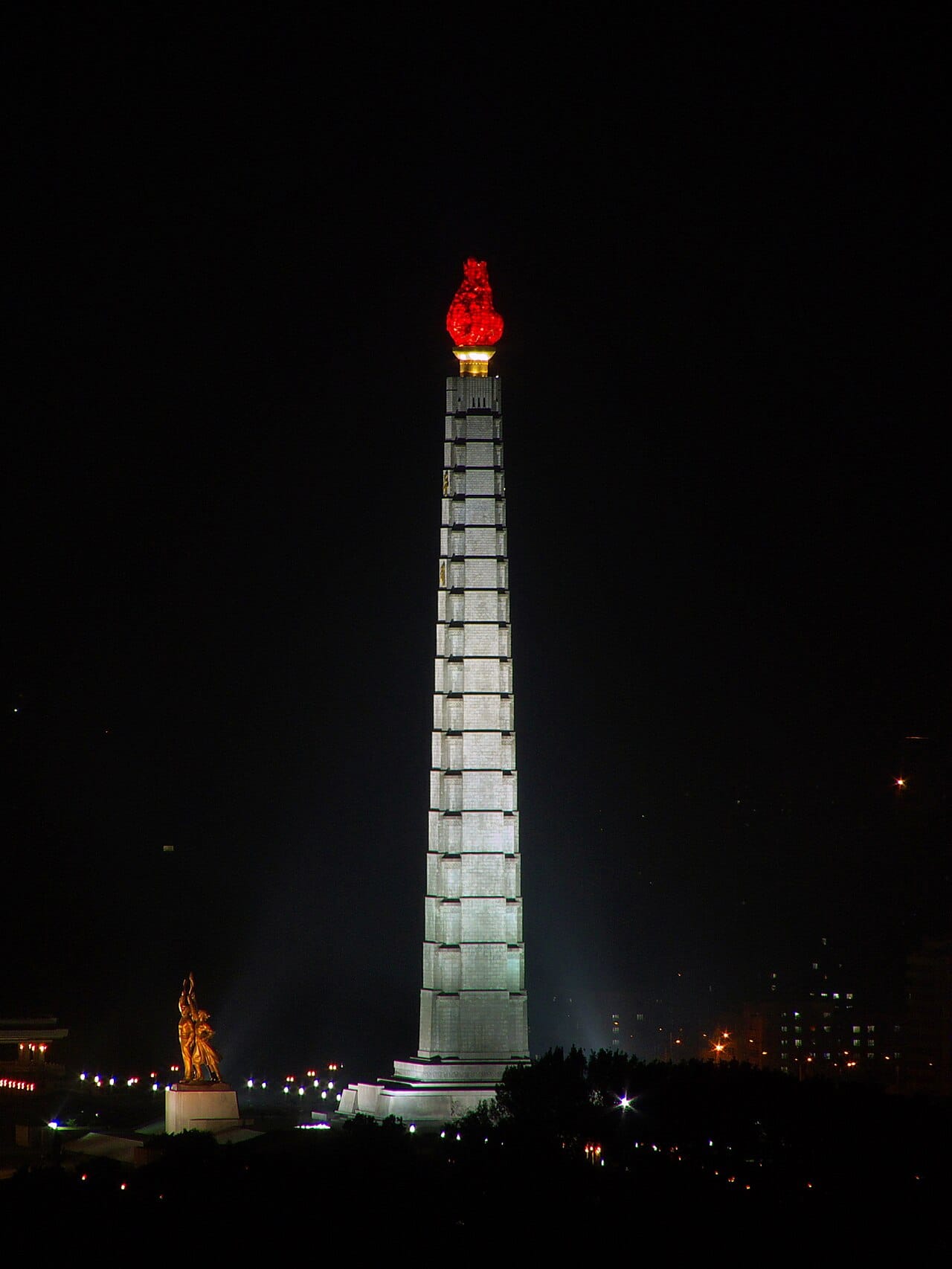 The Tower of the Juche Idea in Pyongyang, built in 1982 for Kim Il Sung's seventieth birthday. Juche, usually rendered as self-reliance, was elaborated into the organising ideology of the entire state.