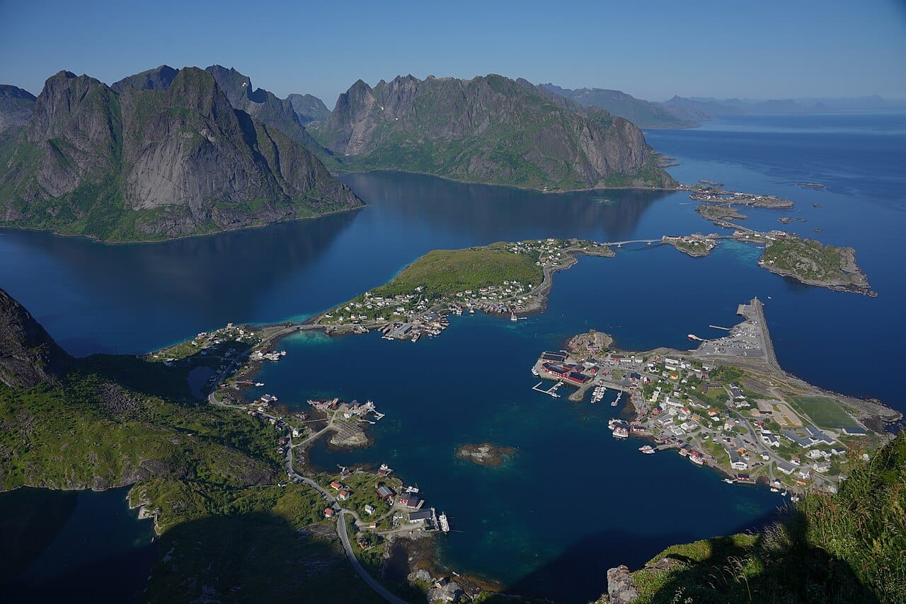 The Lofoten islands, rising sharp and steep from the sea above the Arctic Circle. Norway's long coast reaches far into the Arctic, a realm of the midnight sun in summer and the northern lights in the long winter night.
