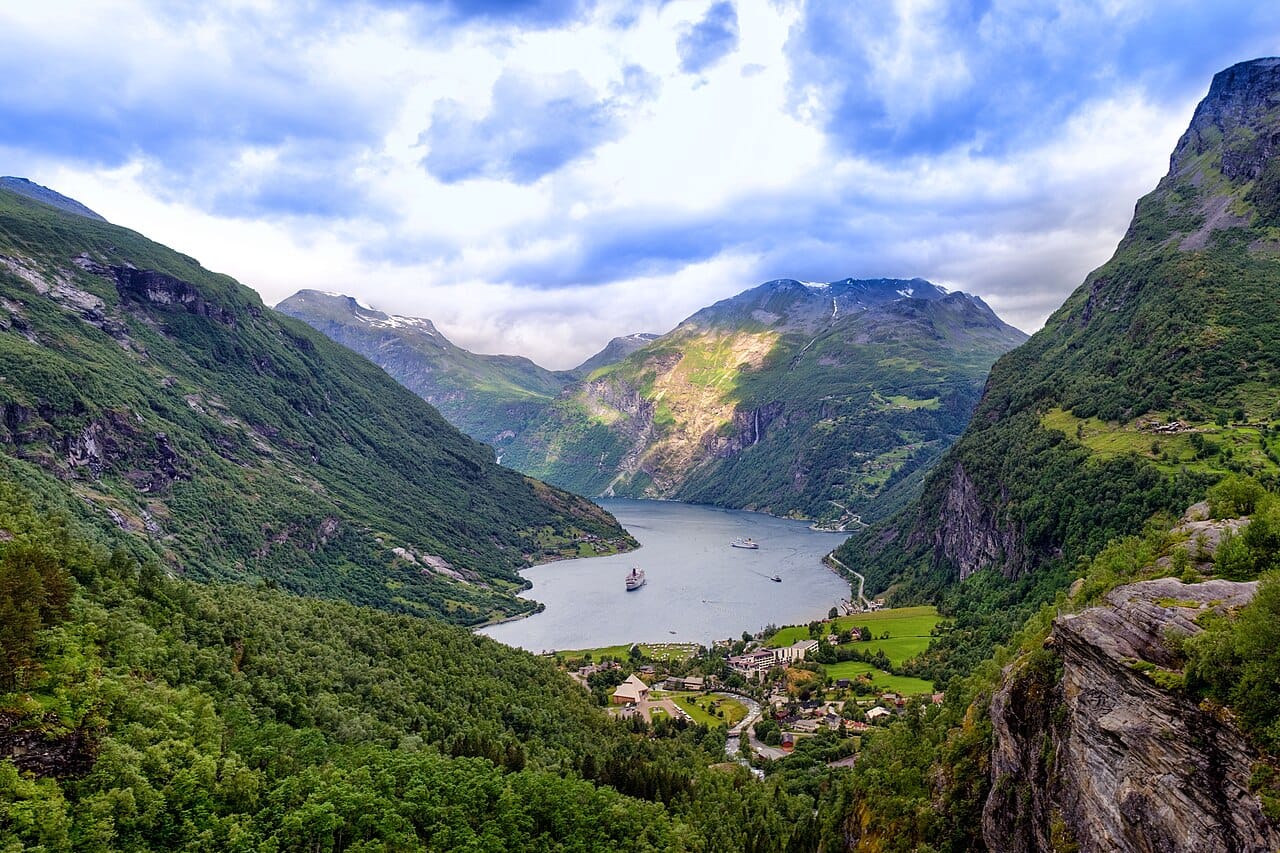 The Geirangerfjord, one of the deep, glacier-carved inlets of western Norway and a World Heritage site. Sheer cliffs, waterfalls, and dark water make the fjords the most famous and most beautiful feature of the Norwegian landscape.