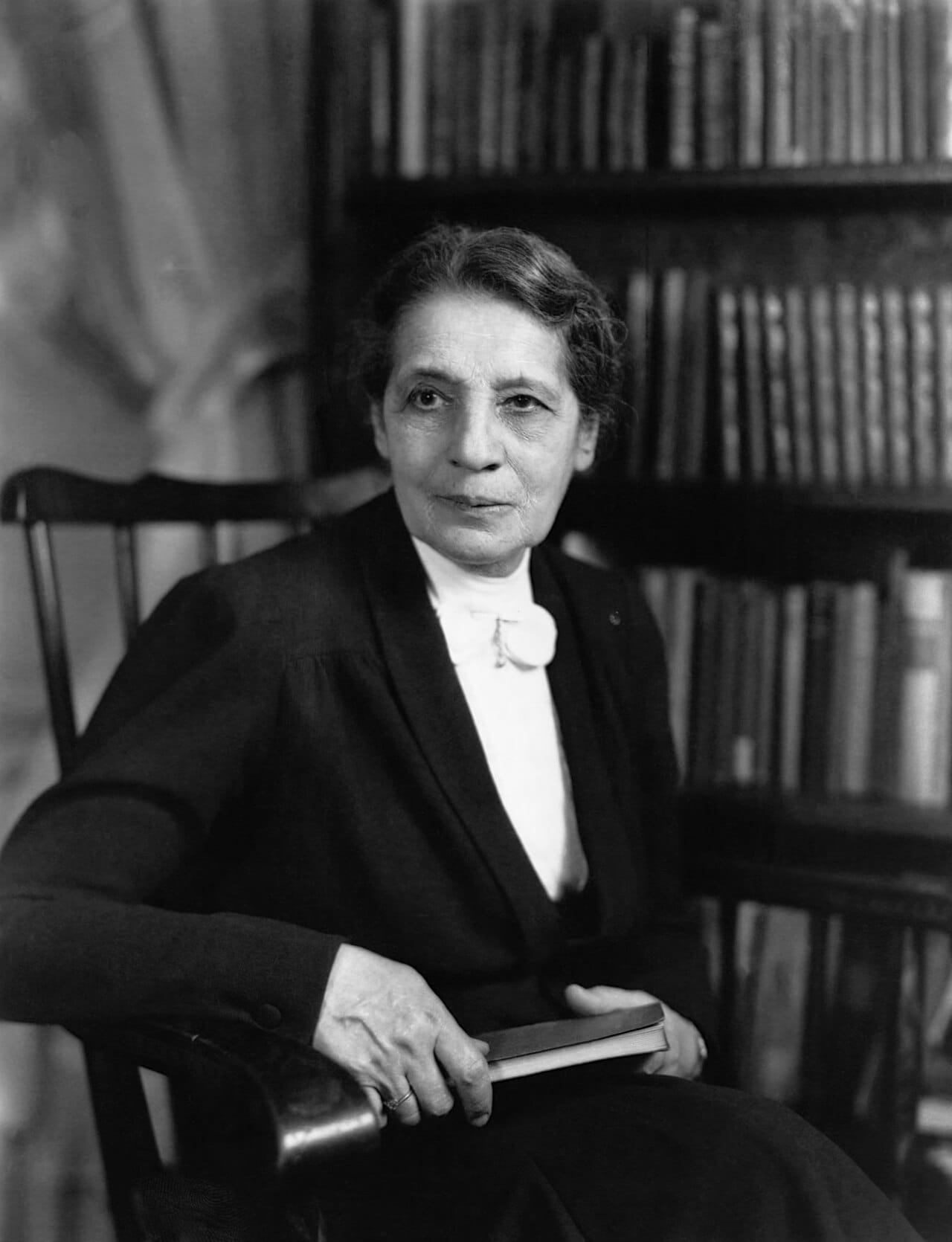 Lise Meitner, who with Otto Frisch explained the barium result as the nucleus splitting, calculated the energy released, and named the process fission. She received no share of the 1944 Nobel Prize.