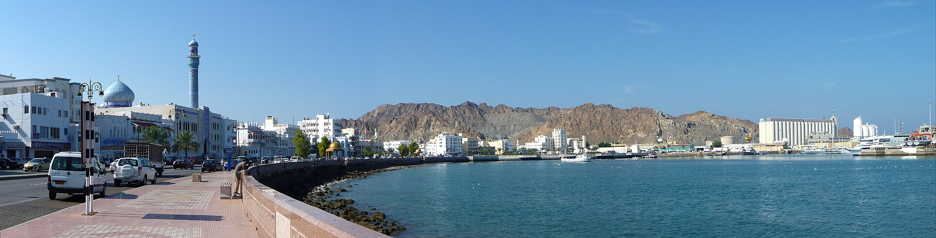 The waterfront of Mutrah in Muscat, with its corniche and old harbour. The capital blends historic forts, mosques, and markets with the trappings of a modern state, set between the Hajar Mountains and the sea.