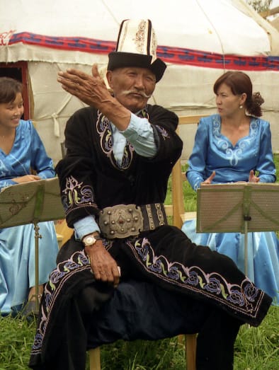 A Kyrgyz manaschi reciting the Epic of Manas. Performances of this epic can run for many hours, and the full work is among the longest recorded anywhere.