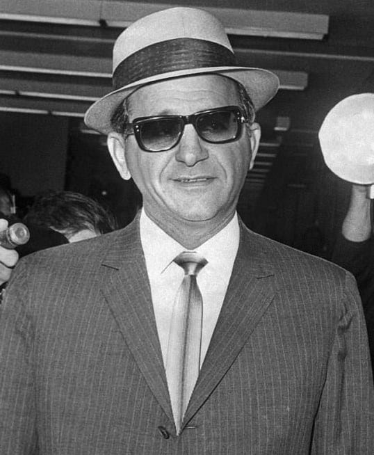 A figure associated with organised crime in mid twentieth century America. Organisations of this kind outlast individual members, which is what distinguishes them from criminal associations.