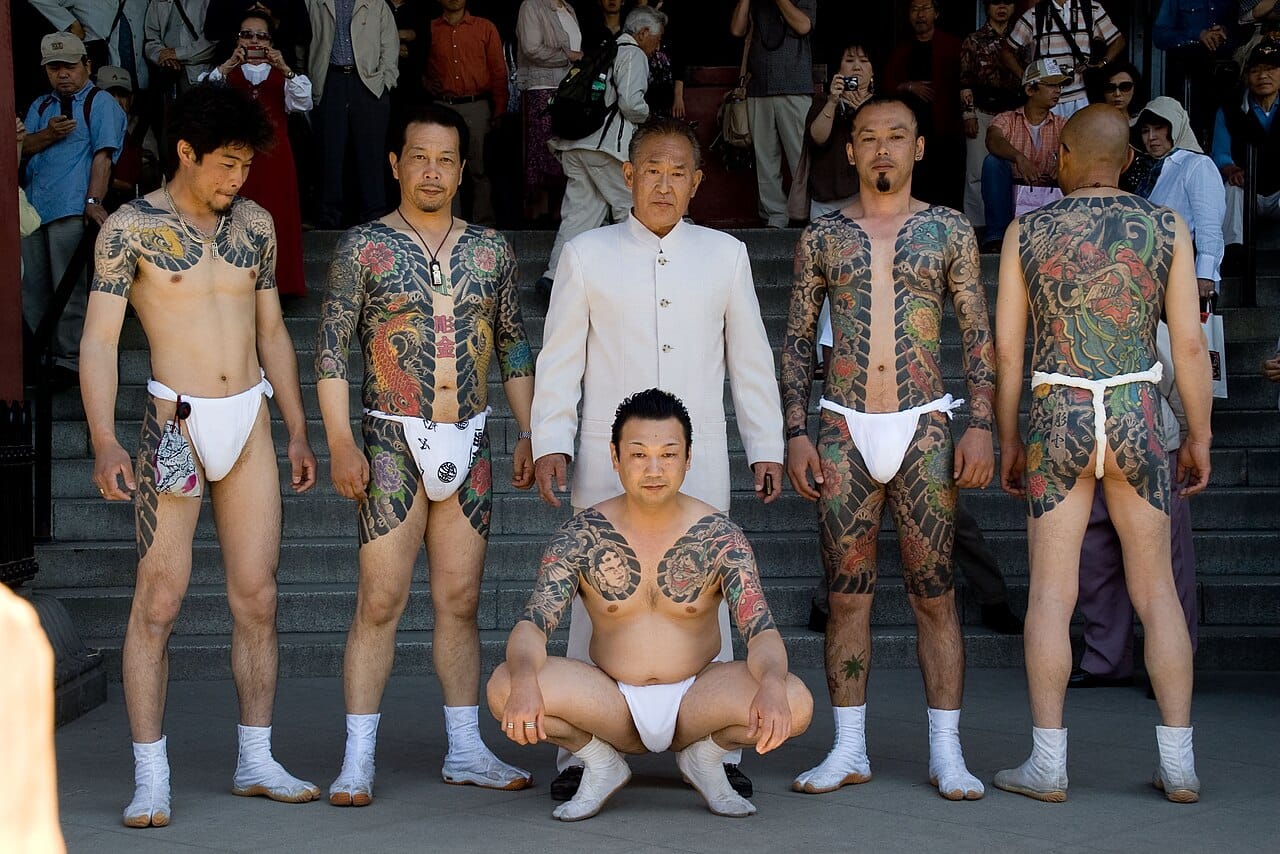Members of a Japanese criminal organisation at a public festival. Some groups have operated semi-openly with recognised structures, which is unusual and reflects particular legal and social arrangements.