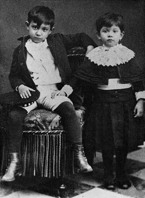 Picasso as a young boy with his sister Lola, 1889.