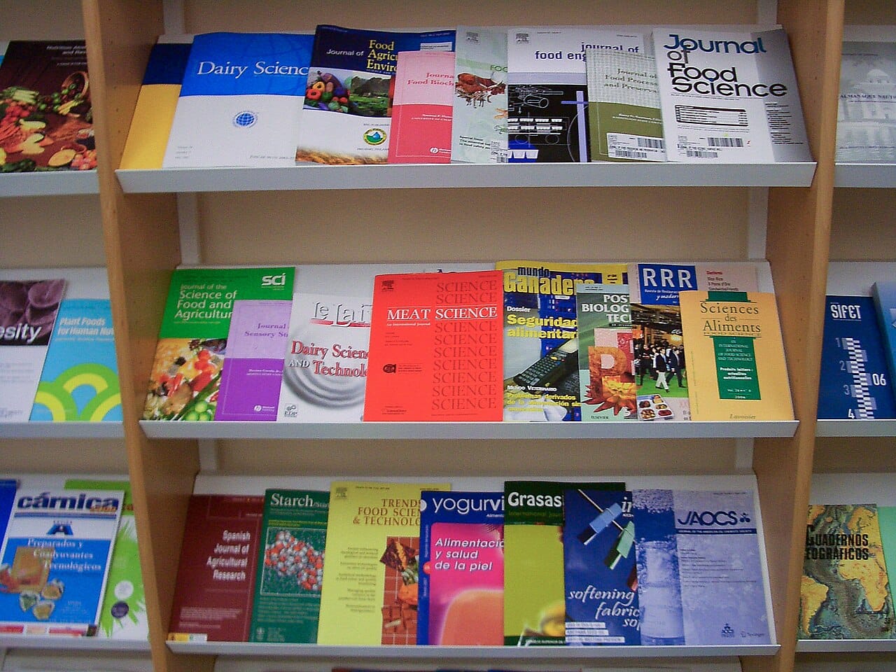 Journals on a library shelf. The volume of published research is far larger than any individual can evaluate, which is the problem peer review is asked to address.