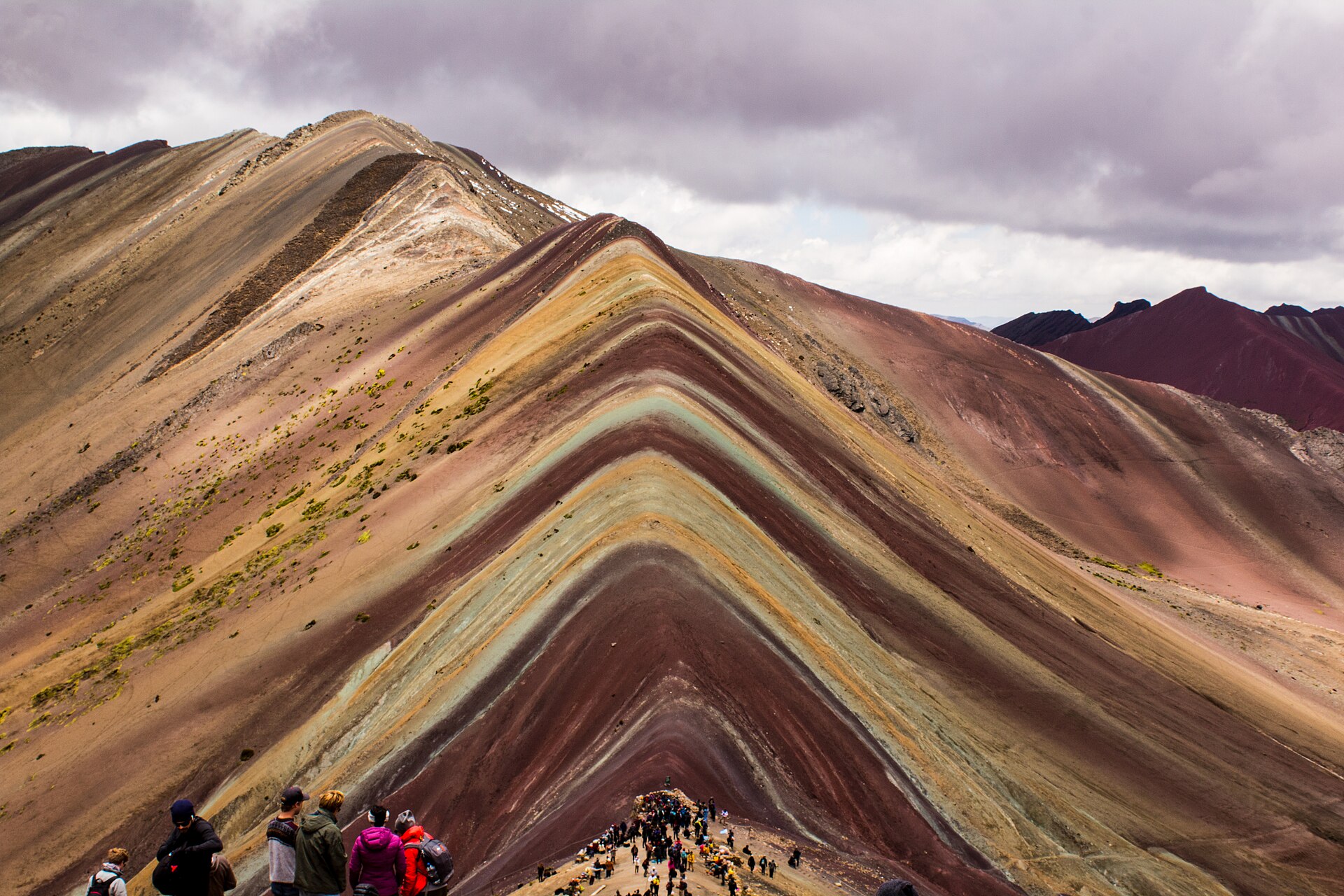 Vinicunca, the Rainbow Mountain, whose mineral-striped slopes rise above five thousand metres in the southern Andes.