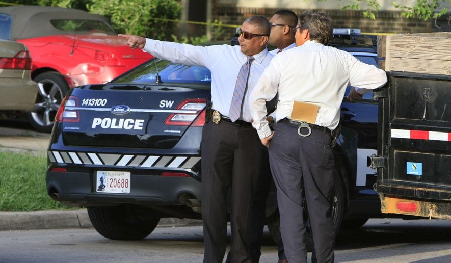 Detectives investigating a homicide. Investigation of serious crime is a small fraction of police work and the part most closely matching public expectation of the role.