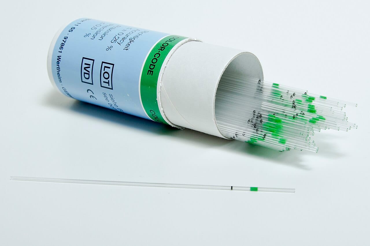 Fine glass capillaries of the kind the experiments used. Condensing water into tubes this narrow produced samples so small that anything leaching from the walls was present in comparable quantity.