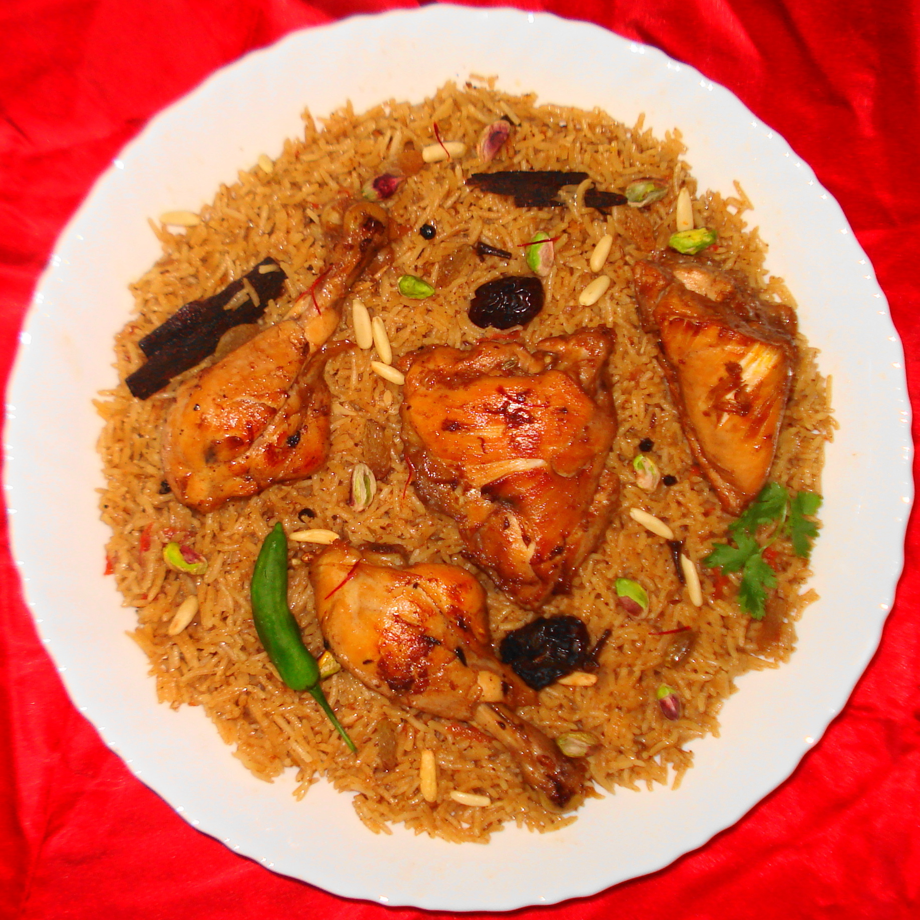 Machboos, the national dish of Qatar and a favourite across the Gulf, of spiced rice cooked with meat or fish. Flavoured with a blend of dried limes and warm spices, it sits at the centre of the region's culture of hospitality.