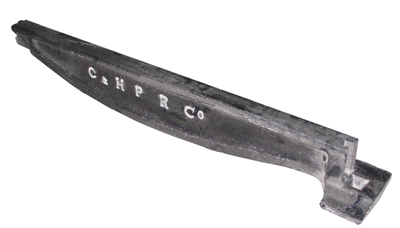 An early cast-iron rail. Rail material and profile developed through repeated failures, since cast iron is brittle and broke under load.